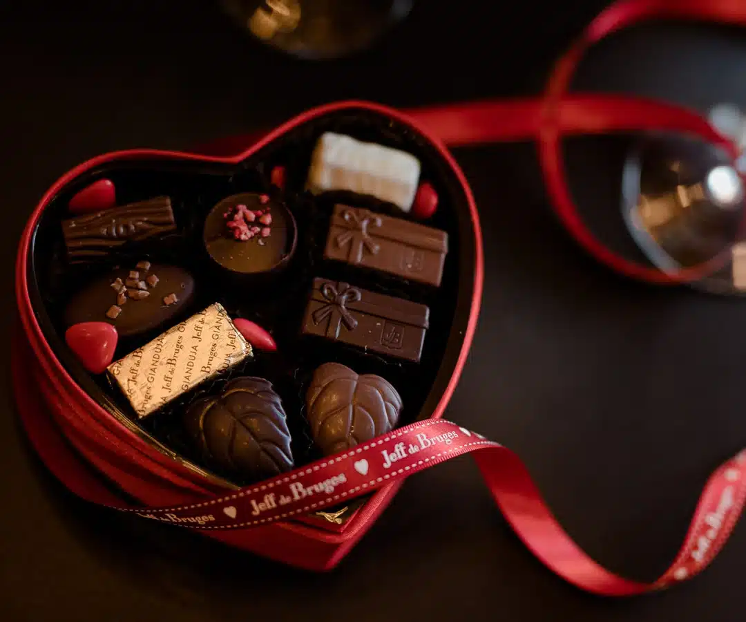 Satin heart filled with Jeff de Bruges chocolates to share in your suite